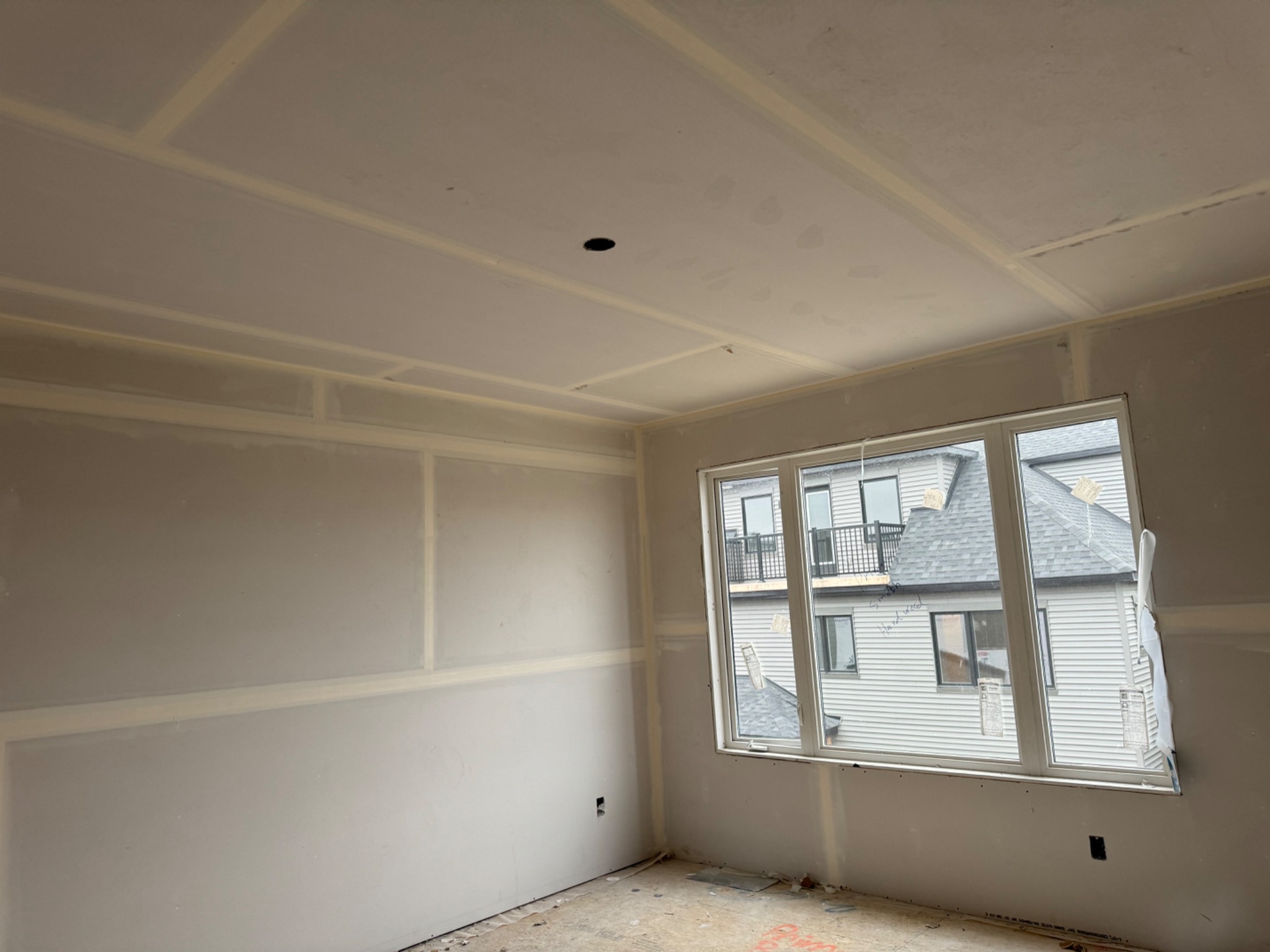 Freshly taped custom room with detailed wall and ceiling joints