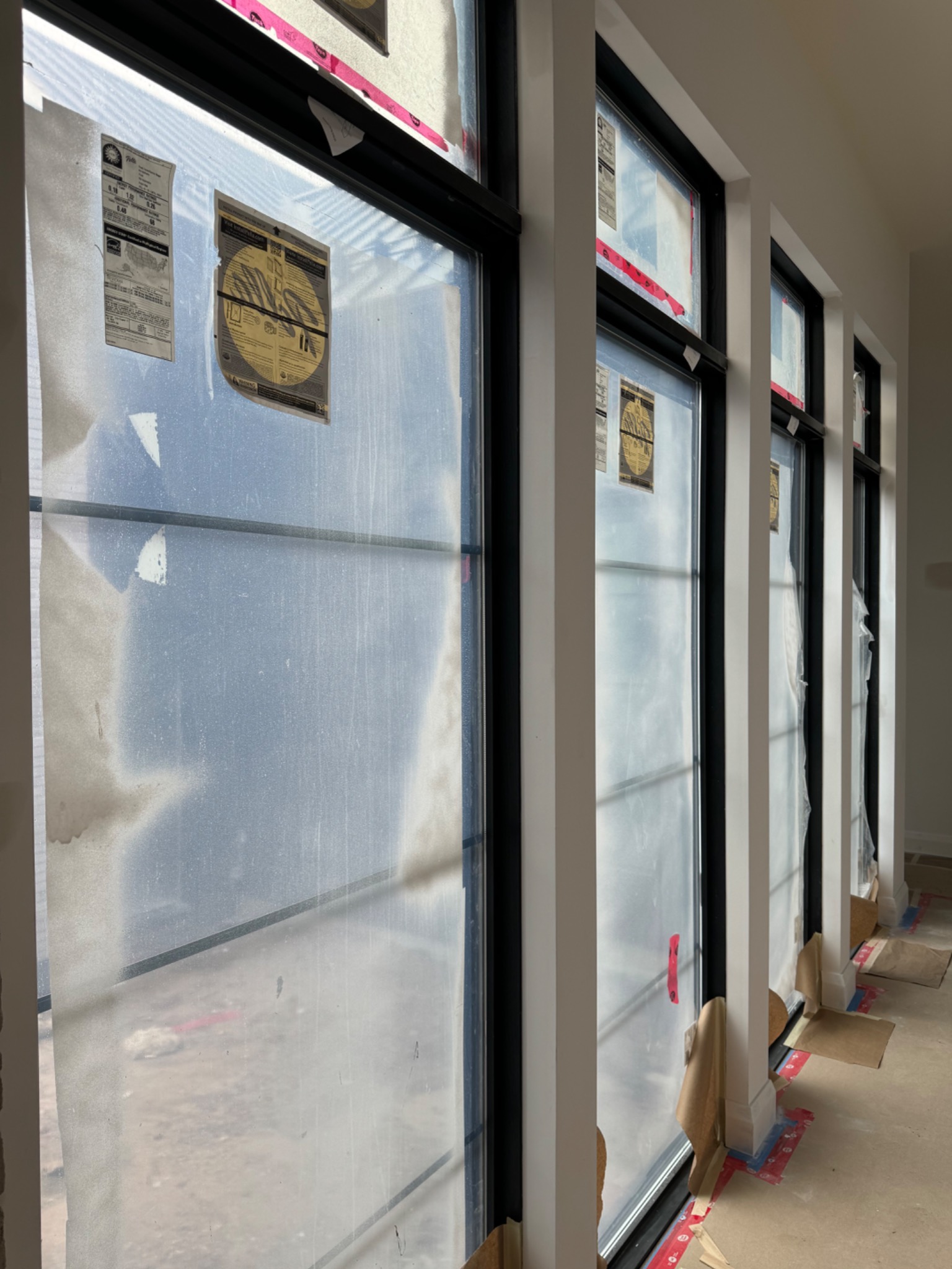 Finished drywall returns around tall modern windows